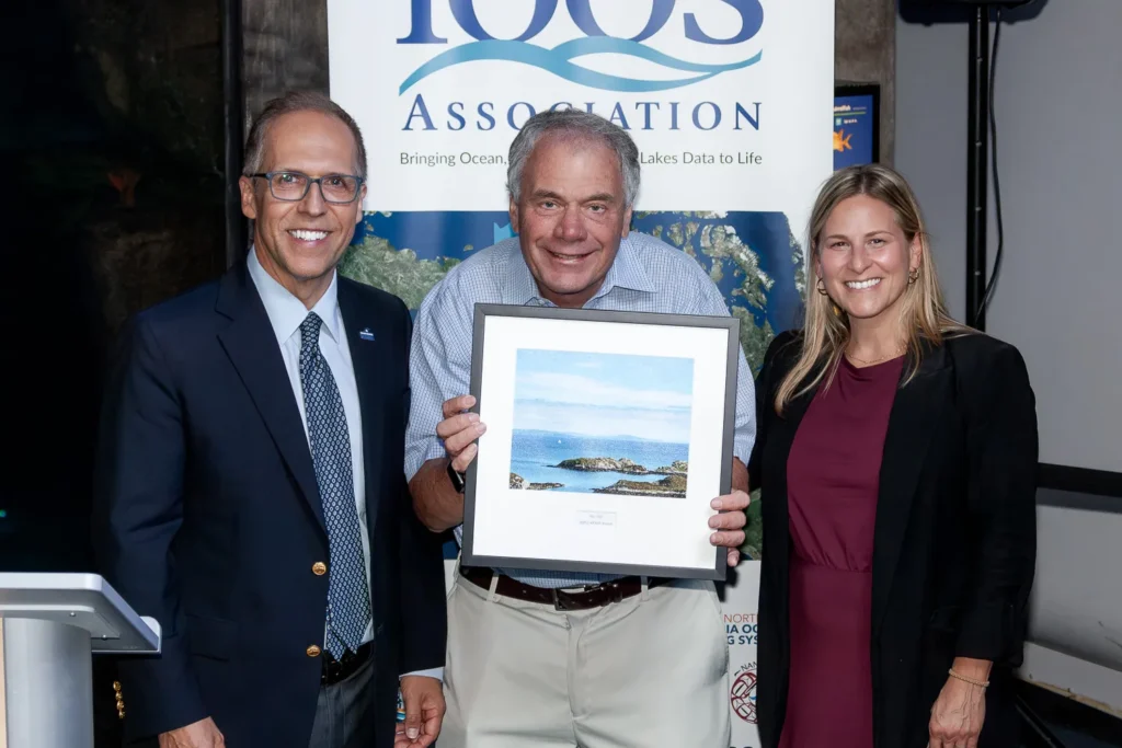 Ray poses with his award and the MARACOOS and IOOS Association directors